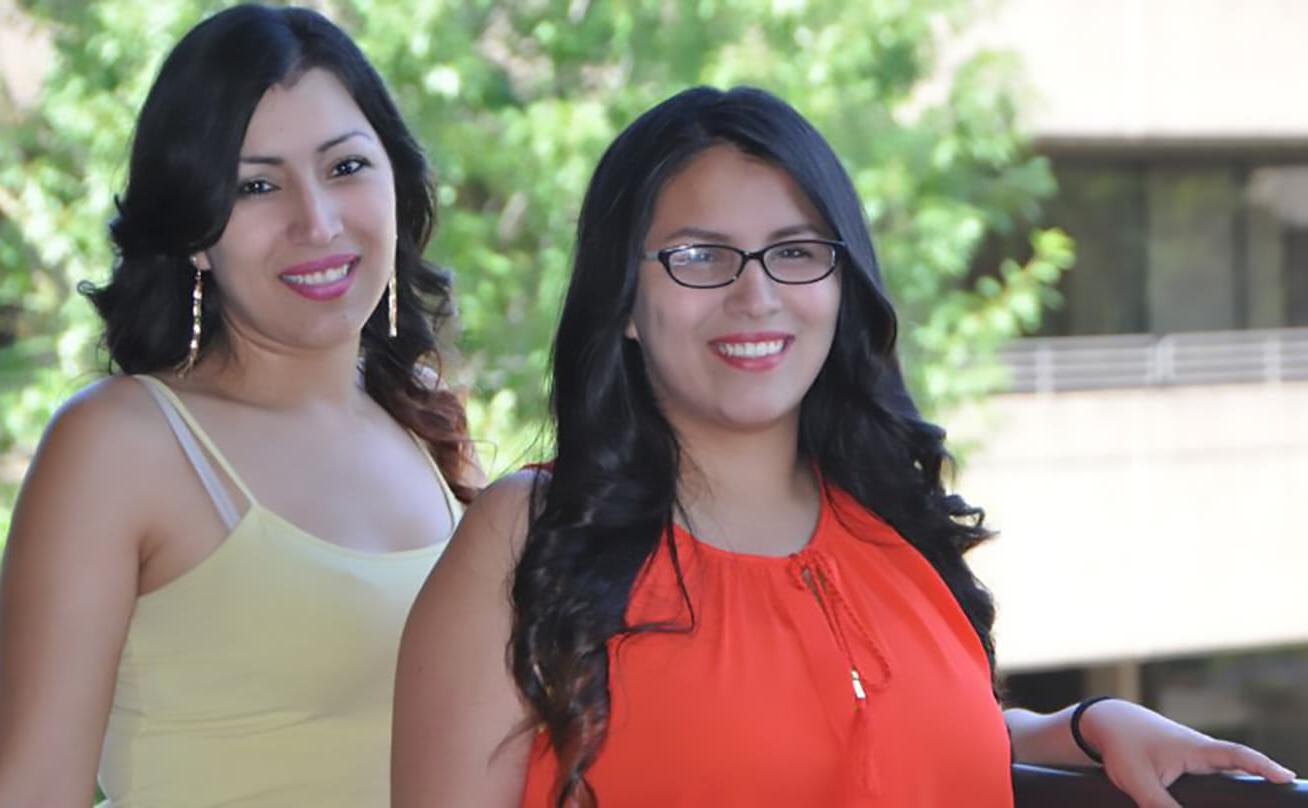 Two women smiling at camera