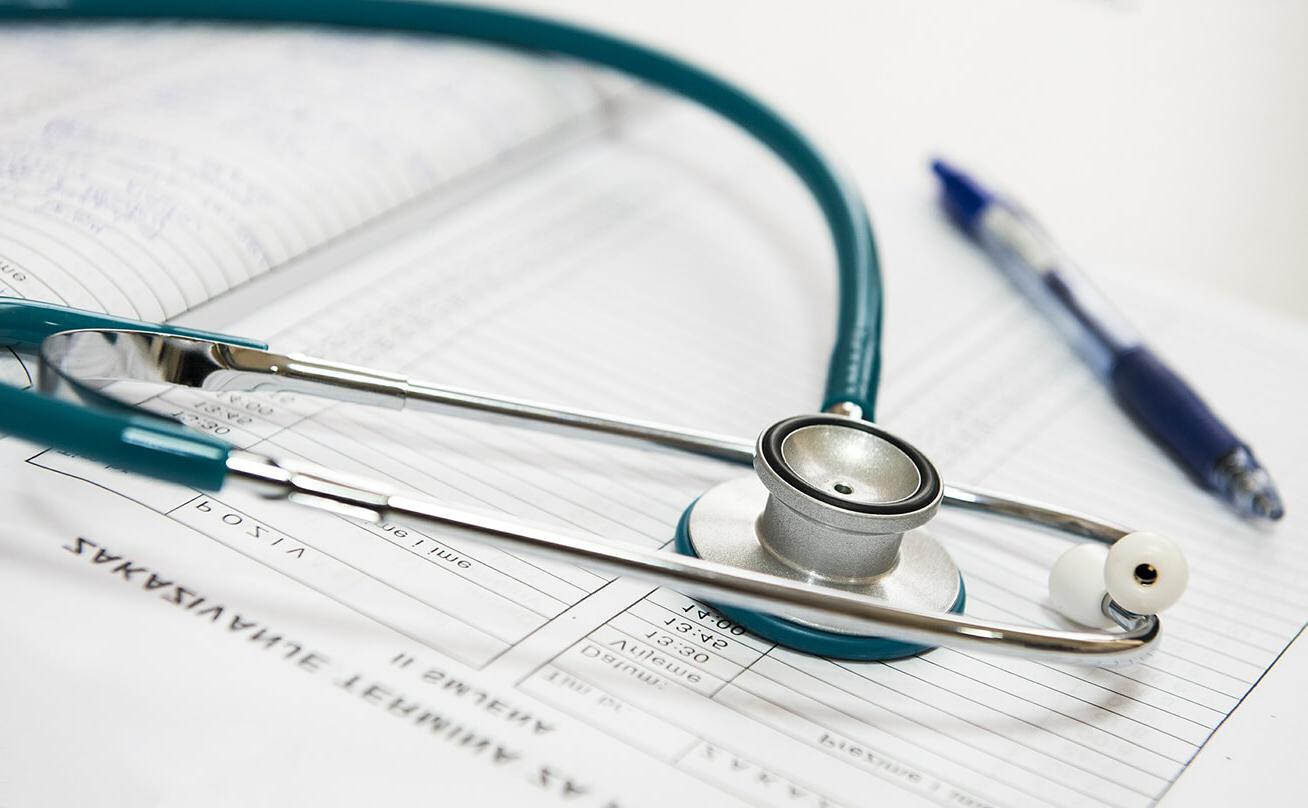 Stethoscope sitting on top of medical paperwork